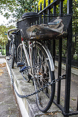 Broken Bicycle chained to Railings,